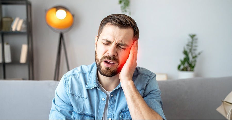 Man in light blue denim shirt doing neck exercises for trigeminal neuralgia relief