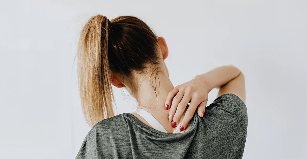 Woman in gray heathered athletic top with high ponytail for neck pain relief