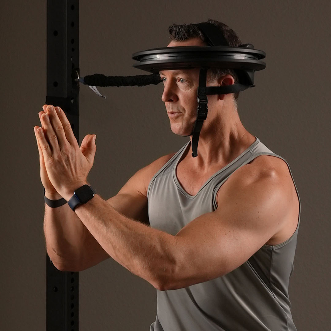 Man performing a Locked Neck body turn with Iron Neck