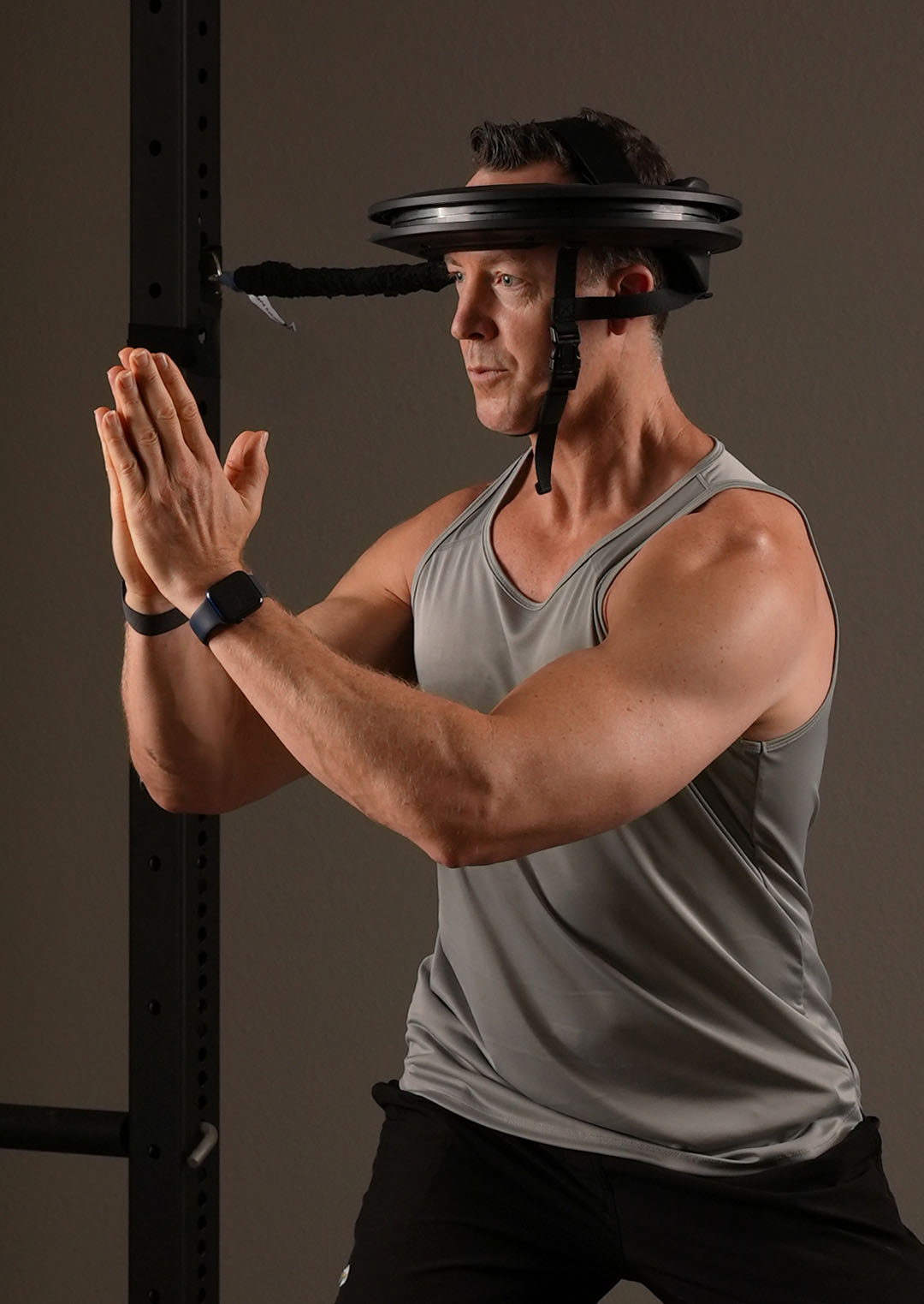 Man performing a Locked Neck body turn with Iron Neck