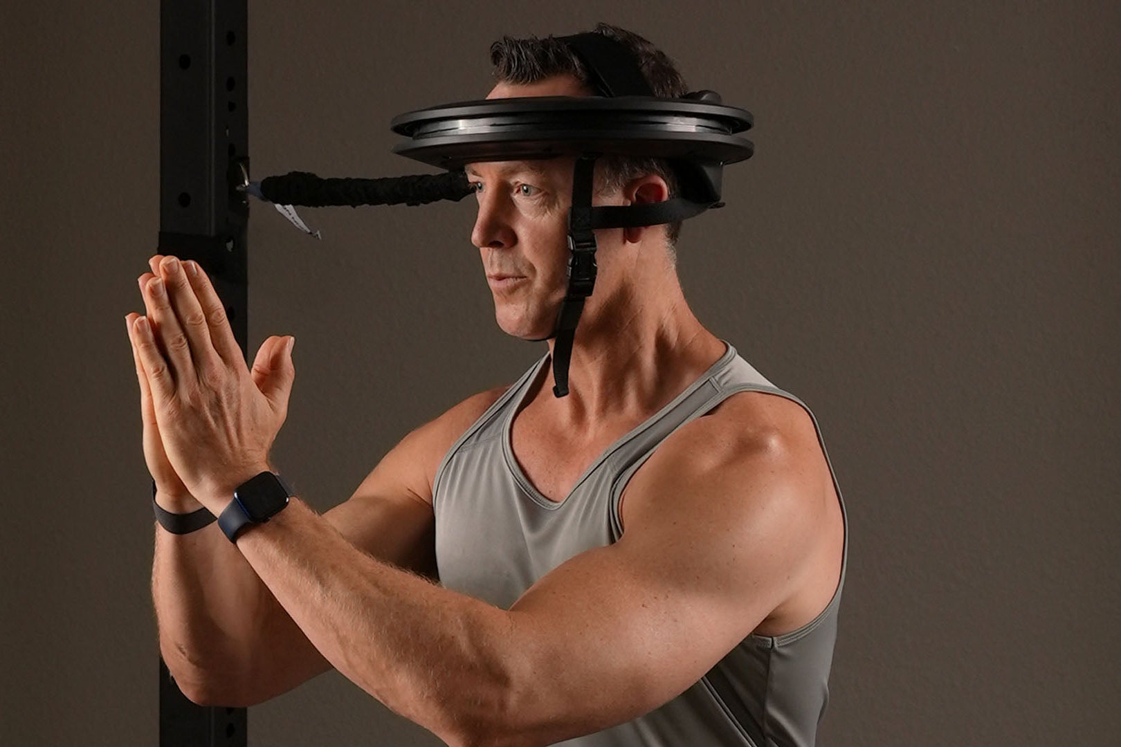 Someone in pain using the Iron Neck 3.0 Pro