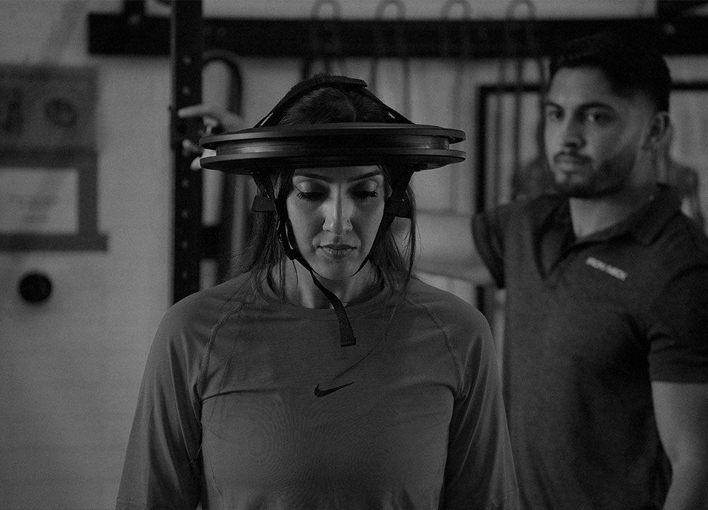 Female Athlete using Iron Neck with Iron Neck Trainer