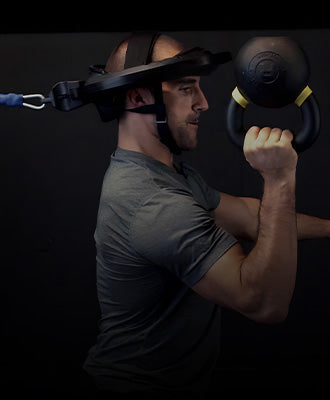 Kettlebell athlete using Iron Neck during a workout