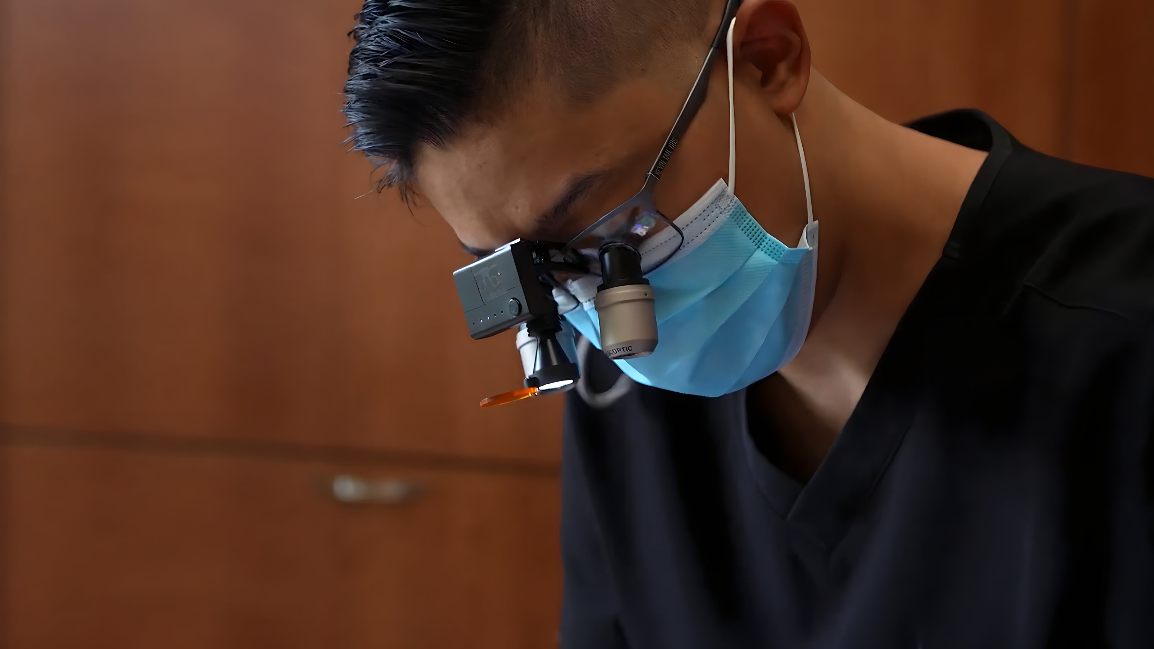 Kevin Tan suffering from neck pain and improving it with Iron Neck